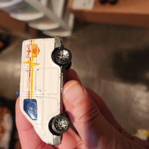 White Toy Car with Orange and Yellow Stripes